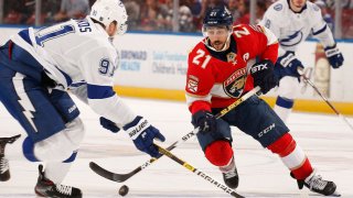 SUNRISE, FL – DECEMBER 10: Vincent Trocheck #21 of the Florida Panthers skates with the puck against Steven Stamkos #91 of the Tampa Bay Lightning at the BB&T Center on December 10, 2019 in Sunrise, Florida. (Photo by Eliot J. Schechter/NHLI via Getty Images)