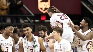 TALLAHASSEE, FL – FEBRUARY 08: The team celebrates as Travis Light (20) guard Florida State University (FSU) Seminoles comes off the bench and goes two-for-two outside the three point arc for six points in the final minute against the Miami Hurricanes, Saturday, February 8, 2020, at the Donald L Tucker Civic Center in Tallahassee, Florida. (Photo by David Allio/Icon Sportswire via Getty Images)