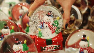 LONDON, ENGLAND – JULY 28: An employee holds a decoration in the Christmas shop at Selfridges department store on July 28, 2011 in London, England. Selfridges launched its Christmas shop today, 149 days ahead of Christmas Day. Foreign tourists are those most likely to take advantage of the early opportunity to take back Christmas gifts.