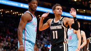 ATLANTA, GA – FEBRUARY 20: Trae Young #11 of the Atlanta Hawks reacts alongside Jimmy Butler #22 of the Miami Heat during the second half of an NBA game at State Farm Arena on February 20, 2020 in Atlanta, Georgia. NOTE TO USER: User expressly acknowledges and agrees that, by downloading and/or using this photograph, user is consenting to the terms and conditions of the Getty Images License Agreement. (Photo by Todd Kirkland/Getty Images)