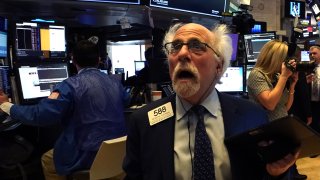 Peter Tuchman, floor trader, reacts as he works on the floor during the opening bell on the New York Stock Exchange on March 9, 2020 in New York.