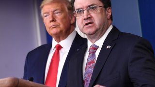 In this March 18, 2020, file photo, Robert Wilkie, U.S. Department of Veterans Affairs secretary, speaks while President Donald Trump, left, listens during a Coronavirus Task Force news conference in the briefing room of the White House in Washington, D.C.