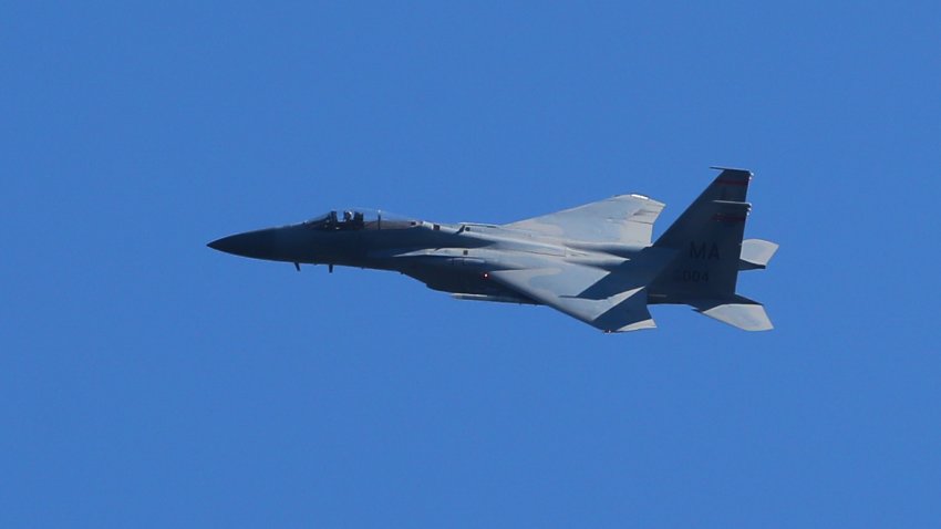 In this Sept. 22, 2019, file photo, an F-15 Eagle of the 104th Fighter Wing flies over Gillette Stadium in Foxborough, Massachusetts, prior to the National Football League game between the New England Patriots and the New York Jets.