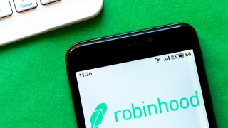 In this photo illustration a Robinhood logo seen displayed on a smartphone.