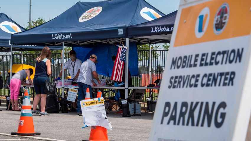 People vote at an early voting station for the special election between Democratic state assembly woman Christy Smith and Republican businessman and ex-Navy pilot Mike Garcia to replace former Democratic Congresswoman Katie Hill in the state's 25th Congressional District, in Lancaster, California on May 10, 2020.