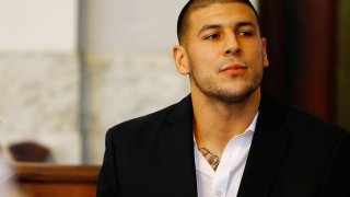 Aaron Hernandez sits in the courtroom of the Attleboro District Court during his hearing on August 22, 2013 in North Attleboro, Massachusetts.