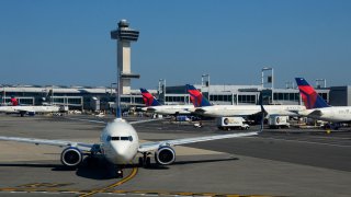 A Delta Airlines passenger jet taxis at John F. Kennedy International Airport in New York, New York,.
