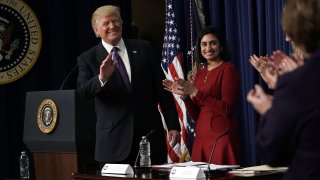 Donald Trump and Seema Verma appear during a 2018 panel