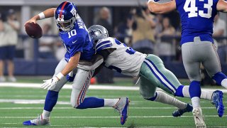 Dallas Cowboys defensive back Kavon Frazier (35) sacks New York Giants quarterback Eli Manning (10) during the second quarter on Sunday, Sept. 16, 2018 at AT&T Stadium in Arlington, Texas.