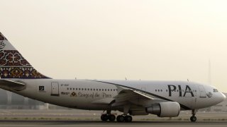 In this July 29, 2008, file photo, a Pakistan Airlines (PIA) Airbus A310-300 sits on the tarmac at Dubai airport.