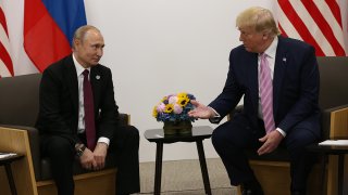 Russian President Vladimir Putin and U.S. President Donald Trump prepare to shake hands during a bilateral meeting at the G20 Summit, June 28, 2019, in Osaka, Japan.