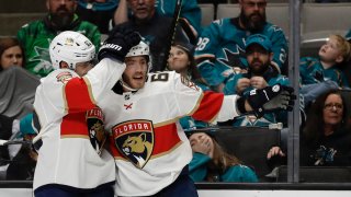 Florida Panthers’ Mike Hoffman, right, celebrates after scoring a goal against the San Jose Sharks in the second period of an NHL hockey game Monday, Feb. 17, 2020, in San Jose, Calif. (AP Photo/Ben Margot)