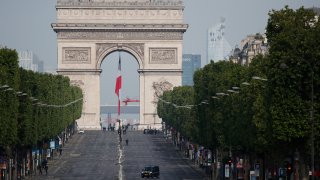 The empty Champs Elysee avenue and the Arc de Triomphe are pictured before VE Day ceremonies Friday May 8, 2020 in Paris.