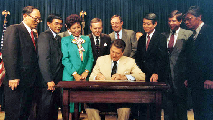 Ronald Reagan Signs Japanese Reperations