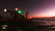 Swimmer jumping off boat