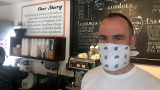 In this April 17, 2020, photo, Zachary Davis poses for a photo at The Penny Ice Creamery in Santa Cruz, Calif.