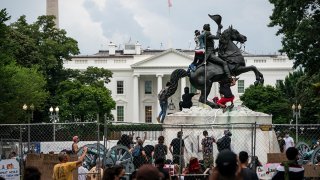 Protesters clash with U.S. Park Police after protesters attempted to pull down the statue of Andrew Jackson in Lafayette Square near the White House on June 22, 2020 in Washington, DC.