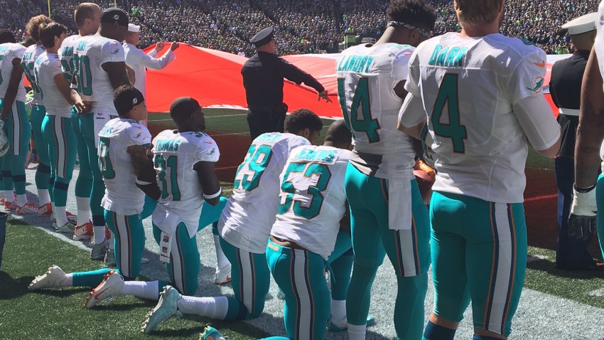 dolphin players kneel