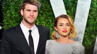 Actor Liam Hemsworth and actress/singer Miley Cyrus arrive at the 2012 Vanity Fair Oscar Party hosted by Graydon Carter at Sunset Tower on Feb. 26, 2012 in West Hollywood, California.