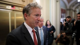 In this Nov. 30, 2017, file photo, Sen. Rand Paul (R-KY) moves through U.S. Capitol during votes in Washington, D.C.