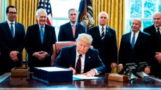 File photo shows US President Donald J. Trump (C) participates in a signing ceremony for the The CARES Act in the Oval Office at the White House in Washington, DC, USA on 27 March 2020. The CARES Act, is a coronavirus COVID-19 stimulus package worth more than two trillion US dollars.