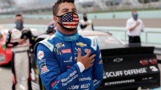Jun 14, 2020; Homestead, Florida, USA; Driver Bubba Wallace stands for the national anthem prior to the NASCAR Cup series race at Homestead-Miami Speedway. Mandatory Credit: Wilfredo Lee/Pool Photo via USA TODAY Network