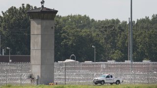In this July 25, 2019, file photo, a truck is used to patrol the grounds of the Federal Correctional Complex Terre Haute in Terre Haute, Indiana.