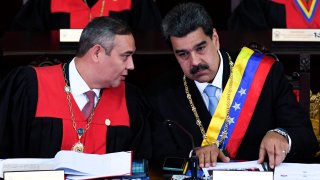 Venezuelan President Nicolas Maduro (R) listens to the president of the Supreme Court of Justice Maikel Moreno (L), during the opening ceremony of the judicial year at the Supreme Court of Justice in Caracas, on Jan. 31, 2020.