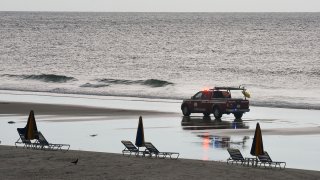 DAYTONA BEACH, FLORIDA, UNITED STATES – 2020/07/03: A beach patrol vehicle drives past empty beach chairs and closed umbrellas on Daytona Beach.
As the number of Covid-19 cases in Florida hit record highs, few people ventured to the beach due to the threat of Covid-19 compounded by intermittent rain storms. (Photo by Paul Hennessy/SOPA Images/LightRocket via Getty Images)