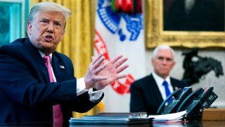 WASHINGTON, DC - JULY 20: U.S. President Donald Trump talks to reporters with Vice President Mike Pence in the Oval Office at the White House July 20, 2020 in Washington, DC. Trump hosted Republican Congressional leaders and members of his cabinet to talk about a proposed new round of financial stimulus to help the economy during the ongoing global coronavirus pandemic.