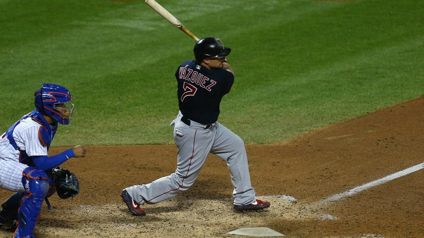 NEW YORK, NEW YORK - JULY 29: Christian Vazquez #7 of the Boston Red Sox hits a 2-run triple in the eighth inning against the against the New York Mets at Citi Field on July 29, 2020 in New York City.