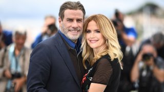 In this May 15, 2018, file photo, actor John Travolta (L) and his wife US actress Kelly Preston pose during a photocall for the film "Gotti" at the 71st edition of the Cannes Film Festival in Cannes, southern France.