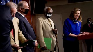 House Speaker Nancy Pelosi of Calif., accompanied by (from left) Rep. Richard Neal, D-Mass., Rep. Dan Kildee, D-Mich., and Rep. Danny Davis, D-Ill., speaks at a news conference on Capitol Hill in Washington, July 24, 2020, on the extension of federal unemployment benefits.