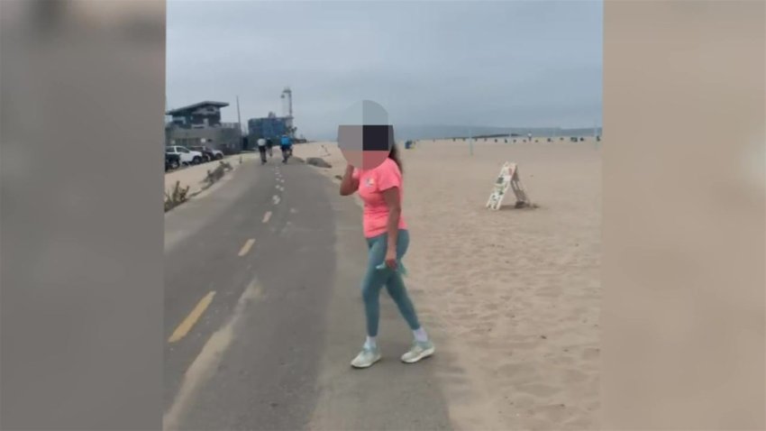 A woman appears to call 911 and say racist things to a runner in El Segundo, California on Sunday, Aug. 30, 2020.