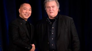 Former White House Chief Strategist Steve Bannon (R) greets fugitive Chinese billionaire Guo Wengui before introducing him at a news conference on November 20, 2018 in New York, on the death of of tycoon Wang Jian in France on July 3, 2018.
