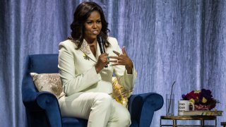 In this file photo, Michelle Obama speaks during her "Becoming: An Intimate Conversation with Michelle Obama" Tour at the Ericsson Globe Arena on April 10, 2019 in Stockholm, Sweden.
