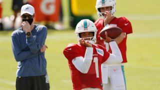 DAVIE, FLORIDA – AUGUST 18: Tua Tagovailoa #1 of the Miami Dolphins throws a pass during training camp at Baptist Health Training Facility at Nova Southern University on August 18, 2020 in Davie, Florida. (Photo by Michael Reaves/Getty Images)
