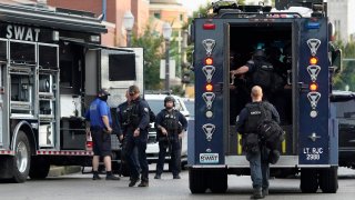 Police work near the scene of a shooting Saturday, Aug. 29, 2020, in St. Louis.