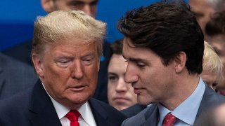 U.S. President Donald Trump (L) ad Canadian Prime Minister Justin Trudeau (R) attend the NATO summit at the Grove Hotel, Dec. 4, 2019, in Watford, England.