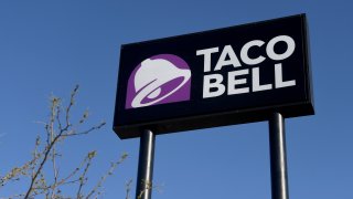 In this March 30, 2020, file photo, an exterior view shows a sign at a Taco Bell restaurant in Las Vegas, Nevada.