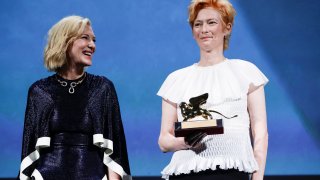 Actress Tilda Swinton, right, holds the Golden Lion for Lifetime Achievement, which was presented by Jury President Cate Blanchett