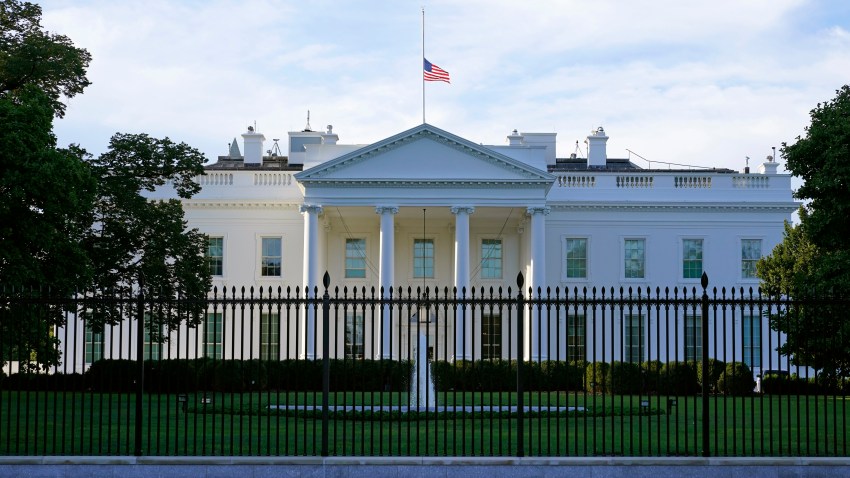 An American flag flies at half-staff over the White House in Washington