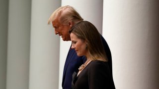 President Donald Trump walks with Judge Amy Coney Barrett to a news conference to announce Barrett as his nominee to the Supreme Court, in the Rose Garden at the White House, Saturday, Sept. 26, 2020, in Washington.