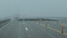 A section of the Pensacola Three Mile Bridge collapses after Hurricane Sandy made its way inland early Wednesday, Sept. 16, 2020, in Pensacola, Florida.