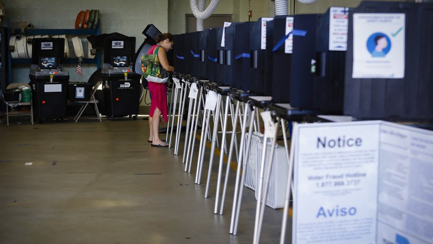 A voter casts a ballot at a polling location in Miami, Florida, U.S., on Tuesday, Aug. 18, 2020. Voters across Florida head to the polls to choose their party’s nominees for a number of important elected offices, including congressional seats, county commissions, state attorneys, sheriffs and mayors among others.