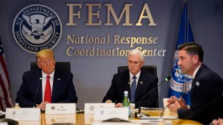 WASHINGTON, DC - MARCH 19: President Donald Trump, left, and Vice President Mike Pence listen as Acting Secretary of Homeland Security Chad Wolf speaks during a teleconference with governors at the Federal Emergency Management Agency headquarters on March 19, 2020 in Washington, DC. With Americans testing positive from coronavirus rising President Trump is asking Congress for $1 trillion aid package to deal with the COVID-19 pandemic.