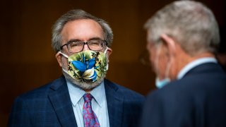 WASHINGTON, DC - MAY 20: Andrew Wheeler, administrator of the Environmental Protection Agency (EPA), wears a face mask as he arrives during a Senate Environment and Public Works Committee hearing, May 20, 2020 on Capitol Hill in Washington, D.C. EPA Administrator Andrew Wheeler will face questions as his agency faces legal challenges and criticism for easing enforcement during the COVID-19 pandemic and rolling back vehicle emissions rules.
