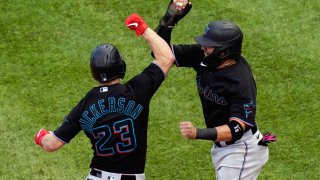CHICAGO, IL – SEPTEMBER 30: Corey Dickerson #23 of the Miami Marlins celebrates with Miguel Rojas #19 after hitting a home run in the seventh inning during Game 1 of the Wild Card Series between the Miami Marlins and the Chicago Cubs at Wrigley Field on Wednesday, September 30, 2020 in Chicago, Illinois. (Photo by Nuccio DiNuzzo/MLB Photos via Getty Images)