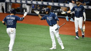 ST PETERSBURG, FLORIDA – SEPTEMBER 04: Yoshitomo Tsutsugo #25 of the Tampa Bay Rays celebrates with teammate Manuel Margot #13 after hitting a solo home run during the second inning against the Miami Marlins at Tropicana Field on September 04, 2020 in St Petersburg, Florida. (Photo by Douglas P. DeFelice/Getty Images)
