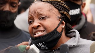 Tafara Williams's mother Clifftina Johnson speaks during a protest rally for Marcellis Stinnette